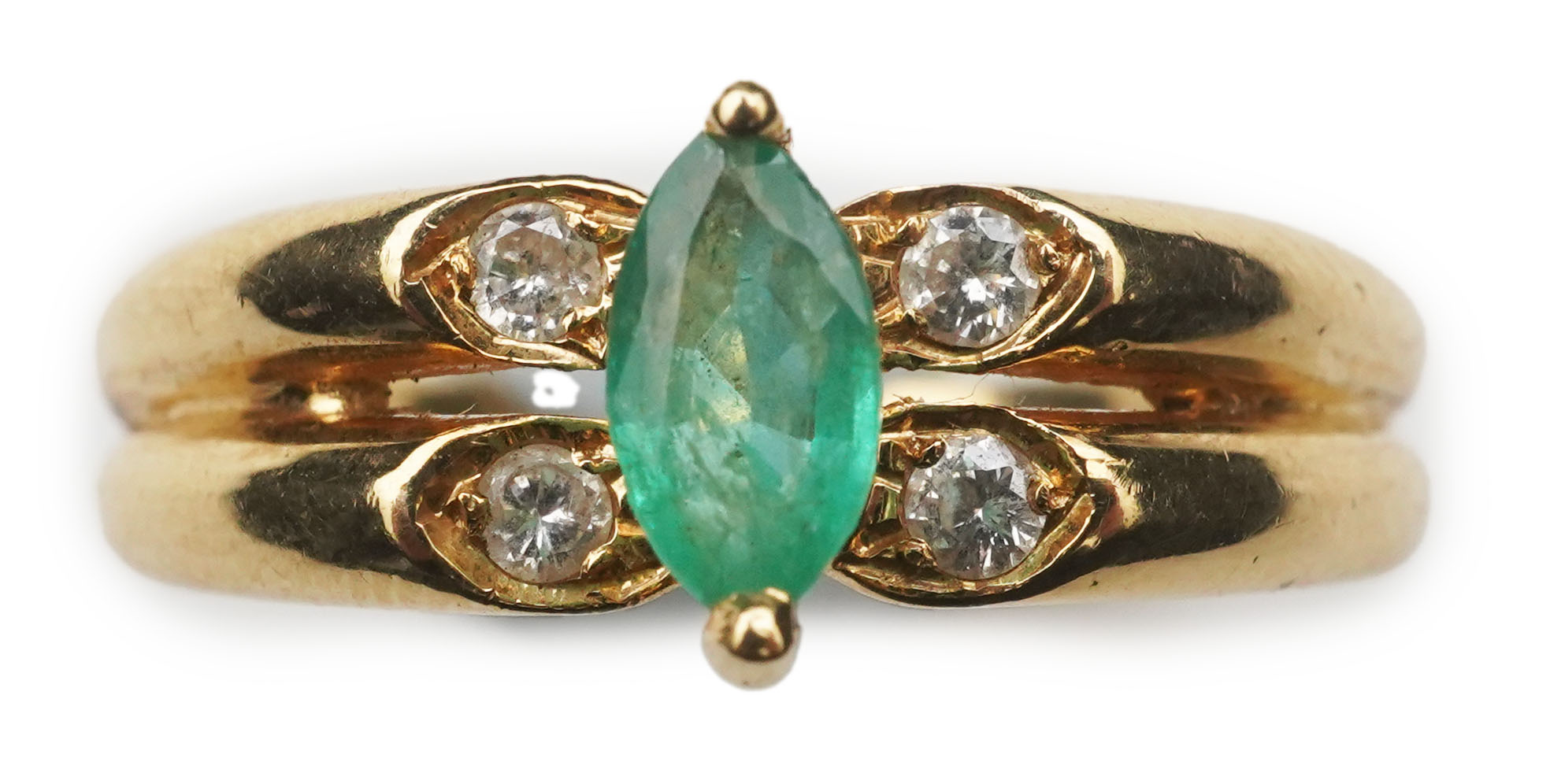 An emerald and diamond ring